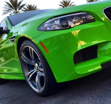 BMW M5 in a gloss green full color change wrap